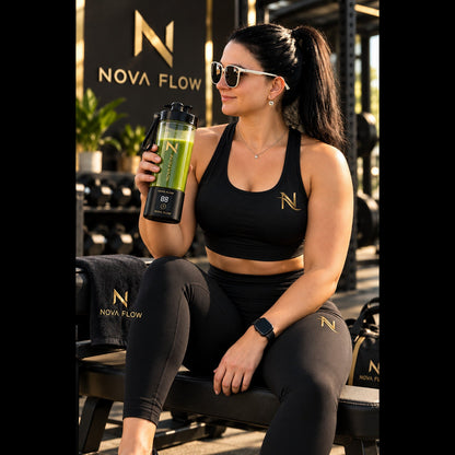 Clarissa wearing gold NovaFlow N athletic branding and holding BlendGo with a green smoothie