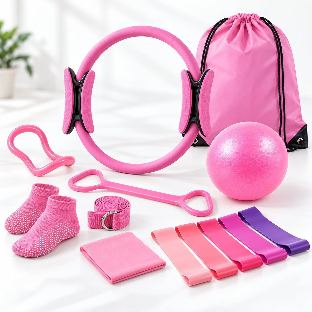 Pink 13-piece Pilates essentials kit: ring, mini ball, resistance bands, stretch accessories, socks and carry bag